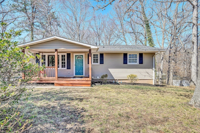 ranch-style home with a front yard and a porch