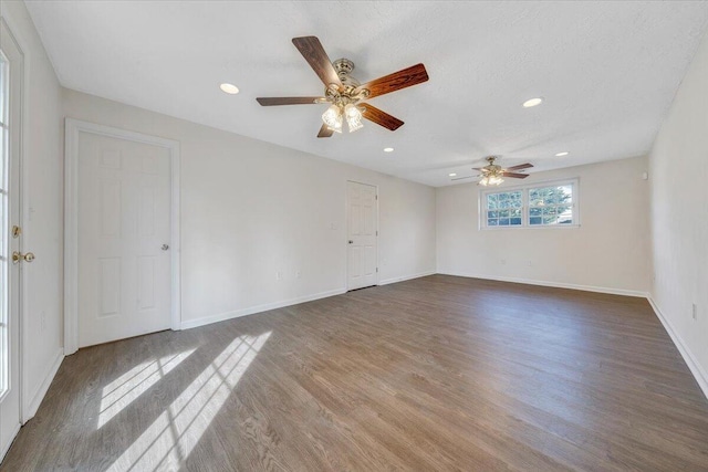 unfurnished room featuring recessed lighting, a ceiling fan, baseboards, and wood finished floors