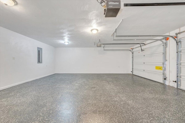 garage with electric panel, baseboards, and a garage door opener