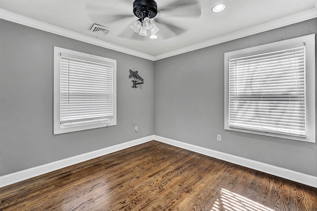 spare room featuring baseboards, ceiling fan, and crown molding