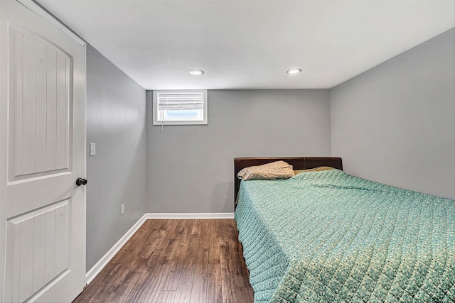 unfurnished bedroom with recessed lighting, baseboards, and wood finished floors