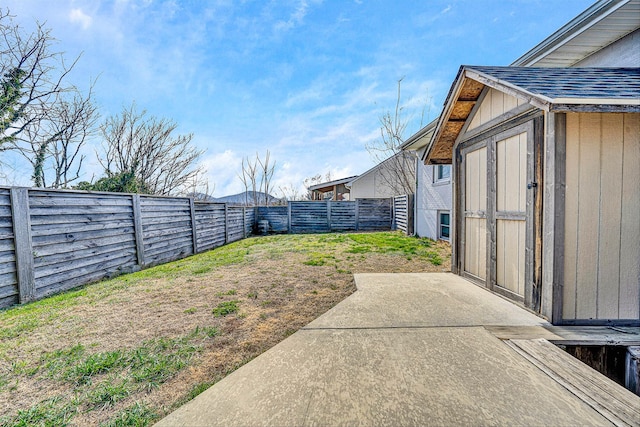 view of yard featuring a patio and a fenced backyard