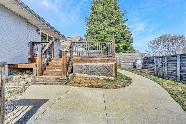 exterior space featuring a deck and fence