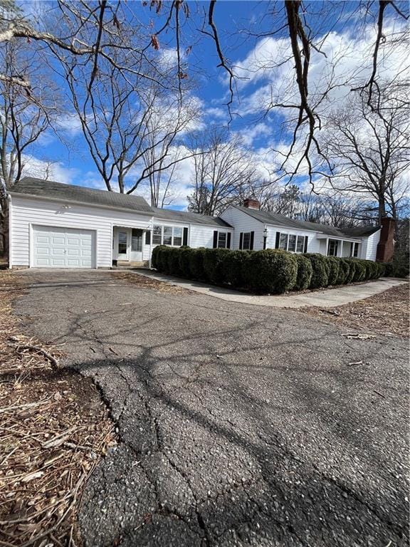 view of front of property with an attached garage and driveway