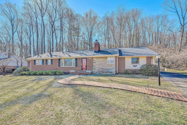 ranch-style house featuring a front lawn, brick siding, and a chimney