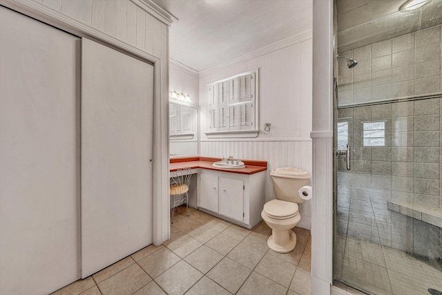 bathroom with tile patterned floors, vanity, toilet, and a shower stall