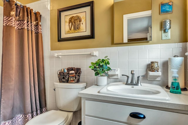 bathroom with vanity, tile walls, toilet, and a shower with curtain