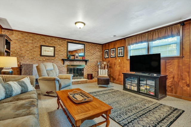 carpeted living room with a fireplace, visible vents, brick wall, and wood walls