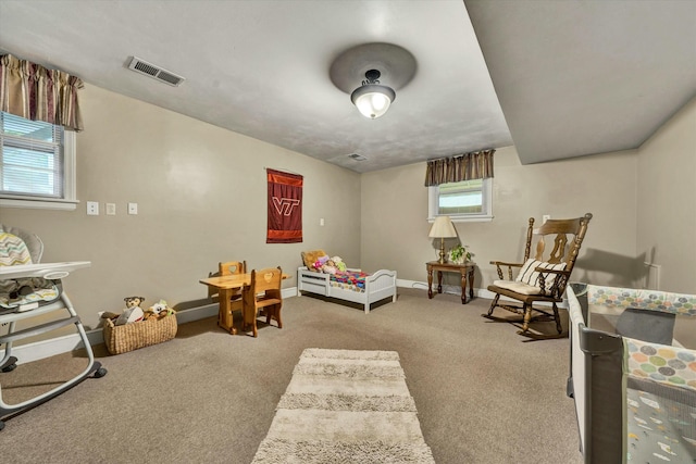 interior space with visible vents, baseboards, and carpet