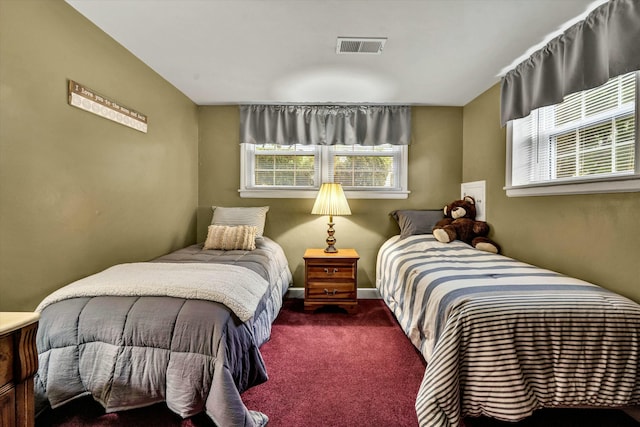 bedroom with visible vents, baseboards, and carpet