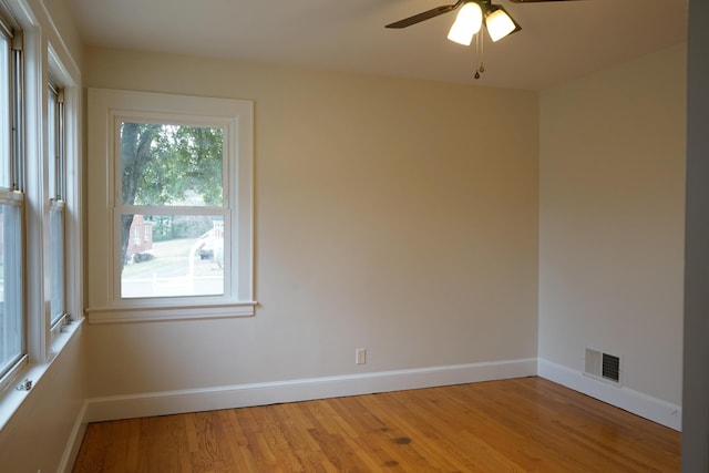 unfurnished bedroom featuring baseboards, visible vents, and light wood finished floors