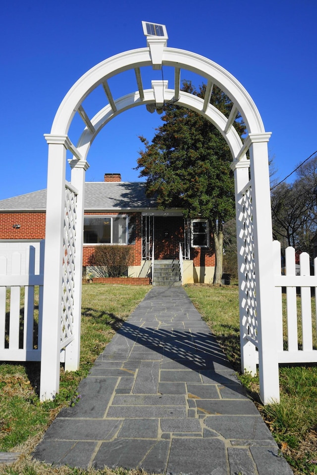 view of home's community featuring fence