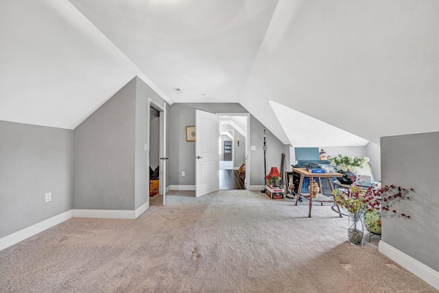 bonus room with baseboards, lofted ceiling, and carpet