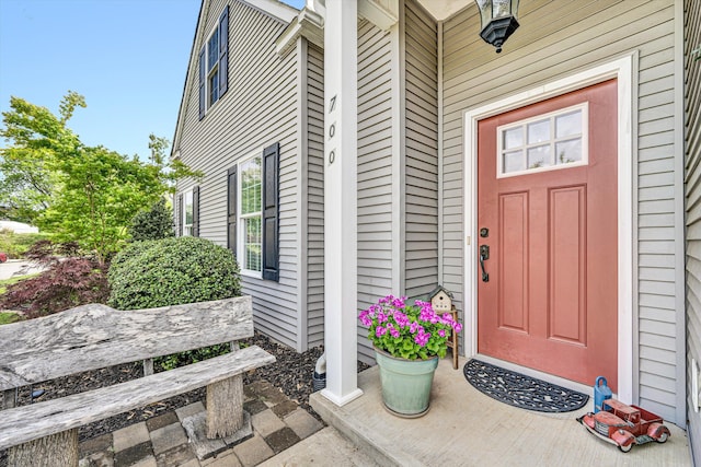 property entrance featuring covered porch