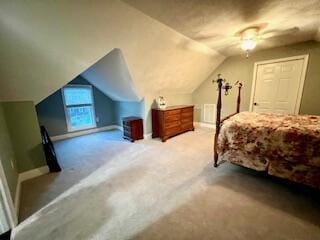 bedroom featuring baseboards, carpet floors, a ceiling fan, and vaulted ceiling