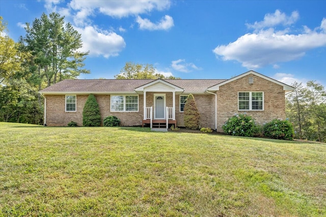 ranch-style home with a front lawn and brick siding