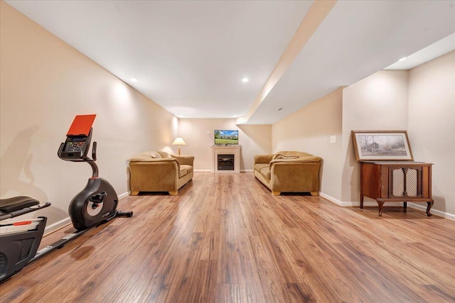 interior space with wood finished floors and baseboards