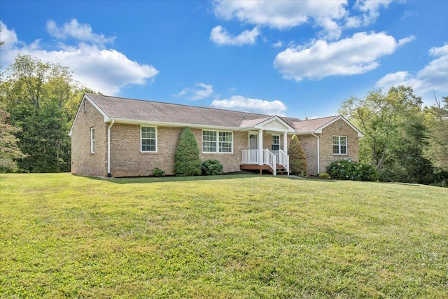 ranch-style house with brick siding and a front lawn