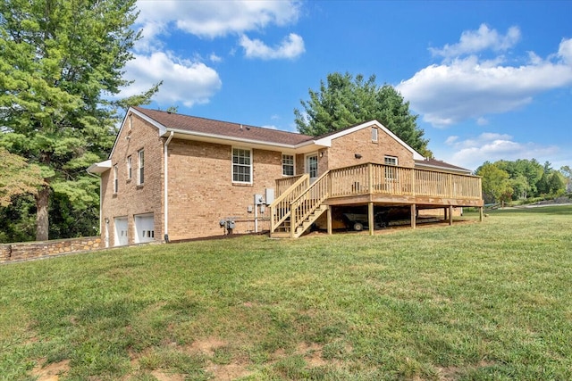 back of house featuring a yard, an attached garage, a wooden deck, brick siding, and stairs