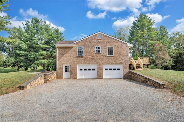 view of side of property featuring driveway, an attached garage, a yard, stairs, and brick siding