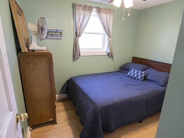 bedroom featuring wood finished floors