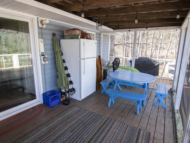 wooden deck featuring area for grilling