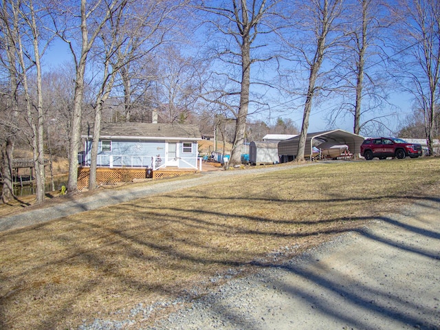 exterior space with a wooden deck and a carport