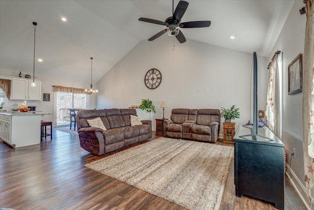 living room featuring ceiling fan with notable chandelier, recessed lighting, dark wood-style floors, and high vaulted ceiling