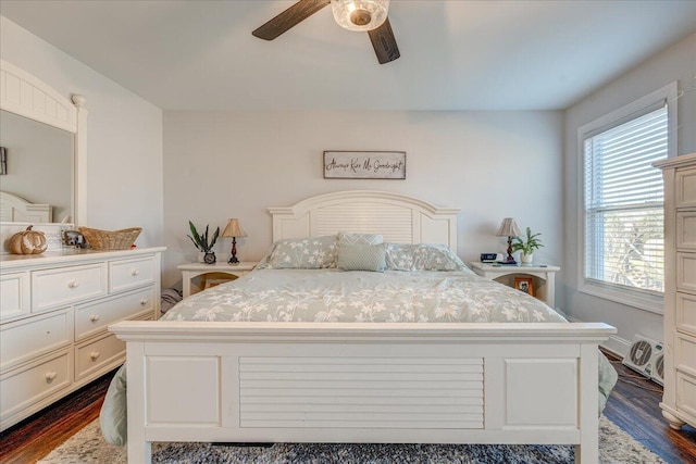 bedroom with dark wood-type flooring and a ceiling fan