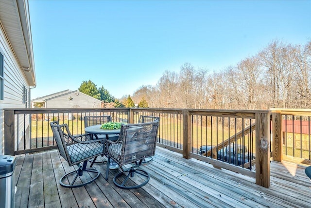 deck with outdoor dining area