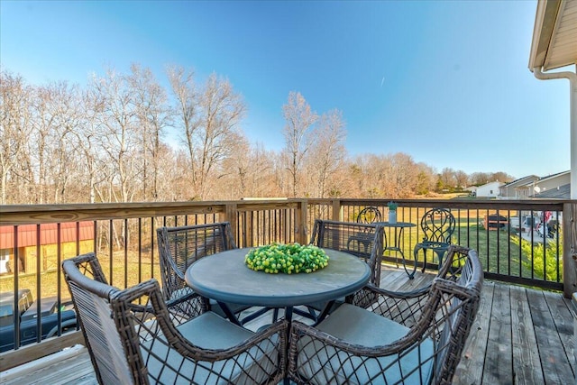 deck with outdoor dining space