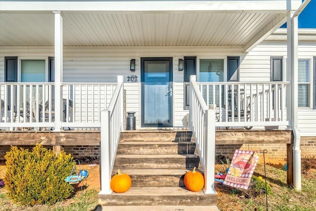 doorway to property with covered porch