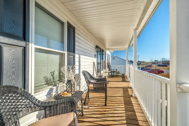 balcony featuring a porch