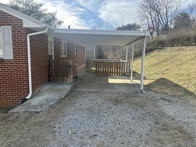 exterior space with a carport