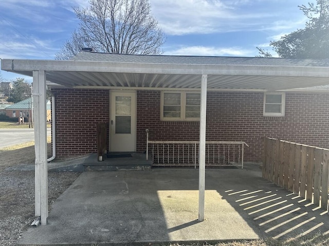 exterior space featuring brick siding