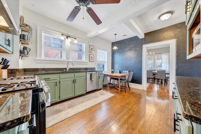 kitchen featuring light wood-style flooring, a sink, black gas range, green cabinets, and stainless steel dishwasher