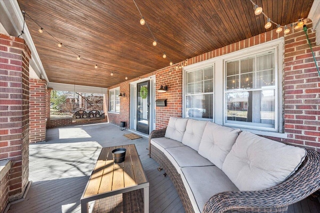 wooden terrace featuring outdoor lounge area