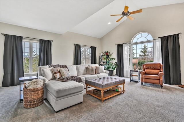 carpeted living room with recessed lighting, high vaulted ceiling, and ceiling fan