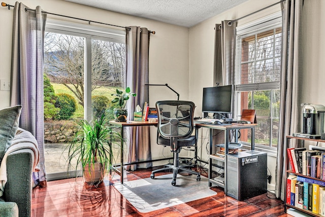 office space featuring a textured ceiling and wood finished floors