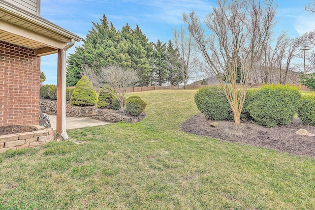 view of yard featuring a patio area and fence