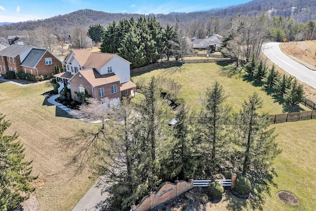 birds eye view of property with a view of trees