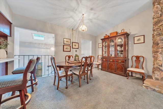 dining room featuring light carpet