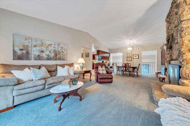 living room featuring carpet flooring and lofted ceiling