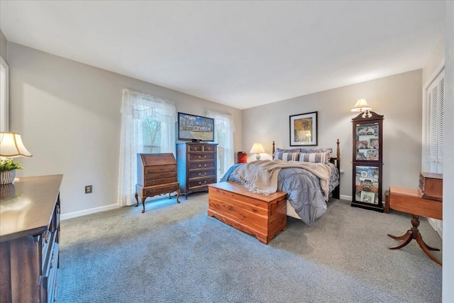 bedroom featuring baseboards and carpet floors