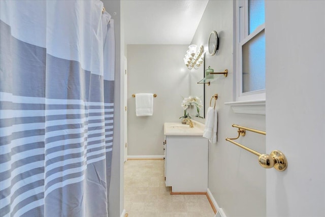 full bathroom with vanity, tile patterned floors, a shower with curtain, and baseboards