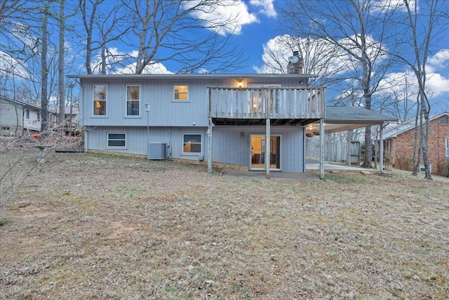 rear view of property featuring a deck and central AC