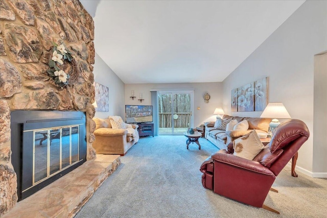 living room with a fireplace, baseboards, carpet, and vaulted ceiling