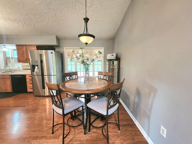 7167 Bent Mountain Rd, Roanoke, VA 24018 - dining room featuring wood finished floors, plenty of natural light, and baseboards