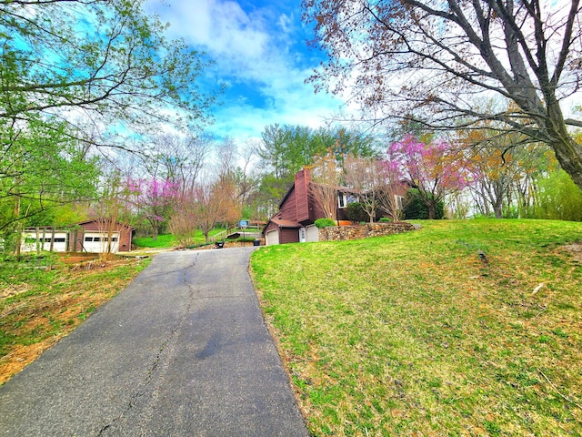 7167 Bent Mountain Rd, Roanoke, VA 24018 - exterior space with a front lawn, a garage, and a chimney