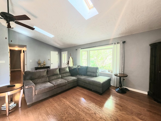 7167 Bent Mountain Rd, Roanoke, VA 24018 - living area with a textured ceiling, vaulted ceiling with skylight, baseboards, wood finished floors, and a ceiling fan